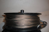 USED SURPLUS MIL-SPEC 132FT REEL OF STAINLESS STEEL 3/16" GUY CABLE WITH 1 SPRING CLIP